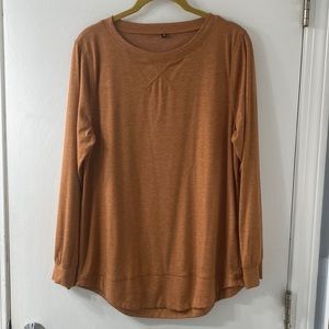 A dark orange long sleeve shirt. Perfect for fall fits!